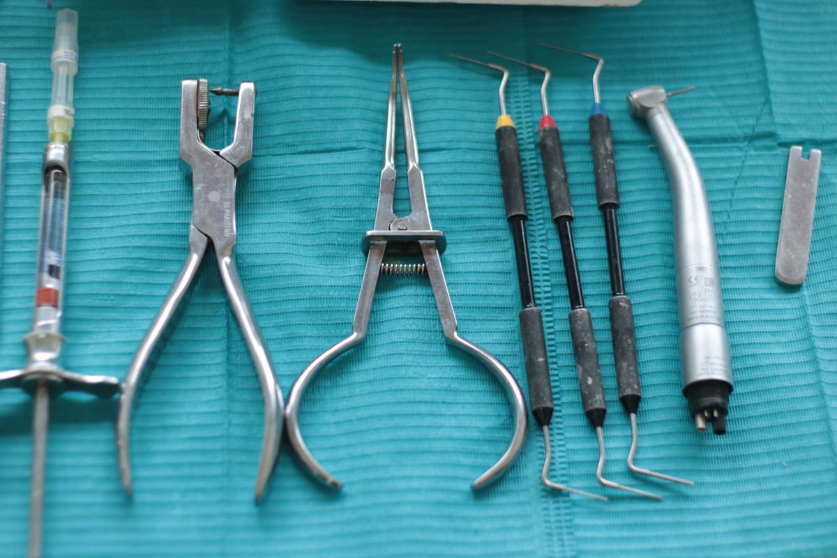 Dental surgical instruments laid out on a sterile drape